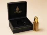 VEIL agarwood oil bottle beside NARIYA OUD gift box